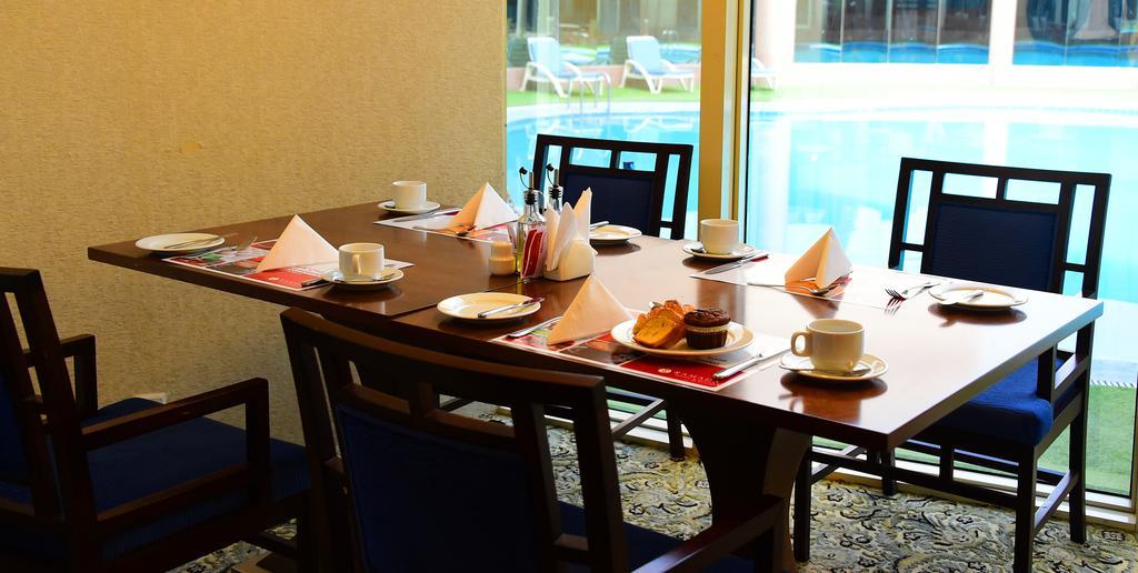 Ramada Hotel & Suites By Wyndham Al Qassim Al Bukayriah Ngoại thất bức ảnh A table set for afternoon tea
