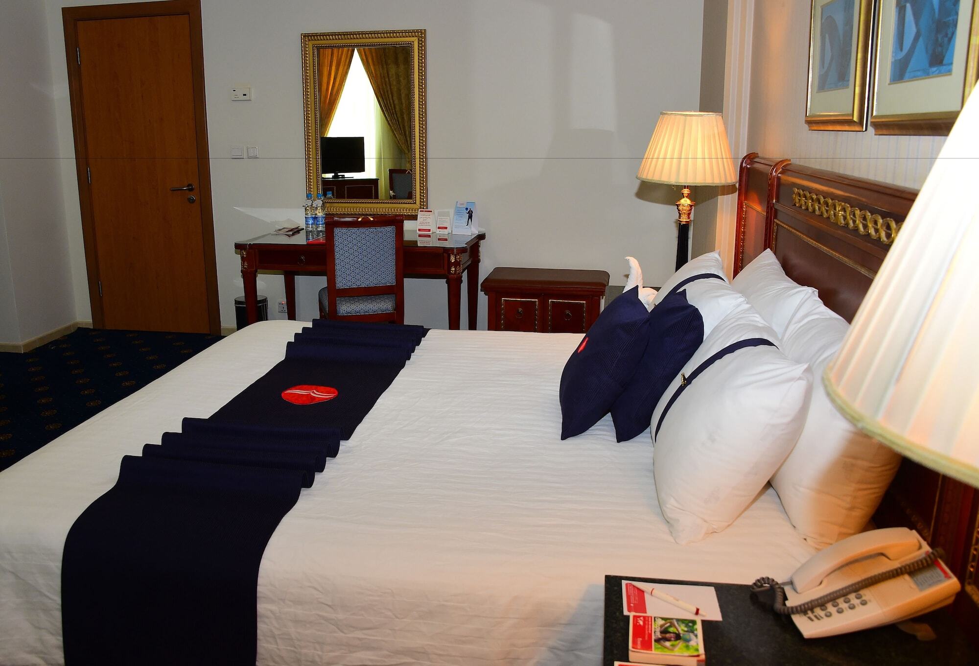 Ramada Hotel & Suites By Wyndham Al Qassim Al Bukayriah Ngoại thất bức ảnh A bedroom at the hotel
